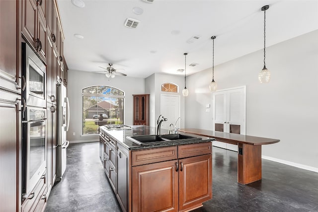18510 Bluffview Dr, Crosby, TX 77532 - kitchen with dark countertops, a sink, stainless steel appliances, baseboards, and visible vents