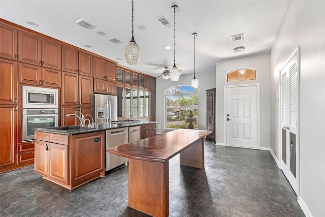 18510 Bluffview Dr, Crosby, TX 77532 - kitchen featuring a center island with sink, stainless steel appliances, and visible vents