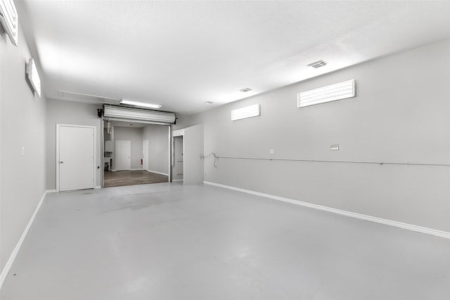 18510 Bluffview Dr, Crosby, TX 77532 - below grade area featuring baseboards, a garage, and visible vents