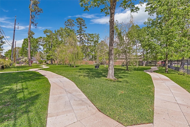 18510 Bluffview Dr, Crosby, TX 77532 - view of property's community with a yard and fence