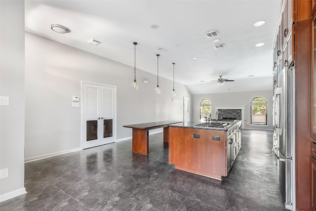 18510 Bluffview Dr, Crosby, TX 77532 - kitchen with freestanding refrigerator, dark countertops, open floor plan, an island with sink, and a ceiling fan