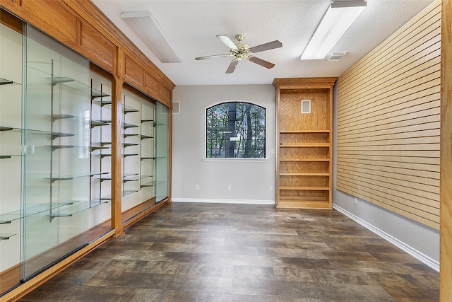 18510 Bluffview Dr, Crosby, TX 77532 - empty room with visible vents, a ceiling fan, dark wood finished floors, and baseboards