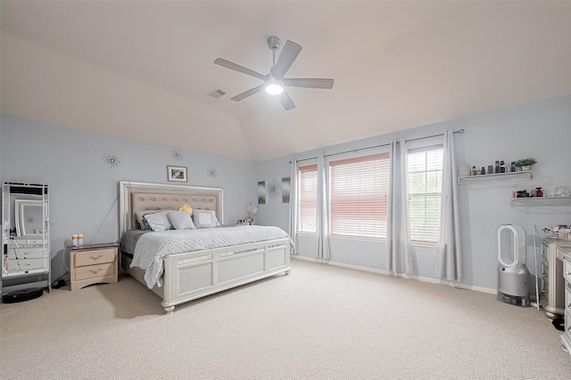 bedroom with vaulted ceiling, a ceiling fan, baseboards, visible vents, and carpet
