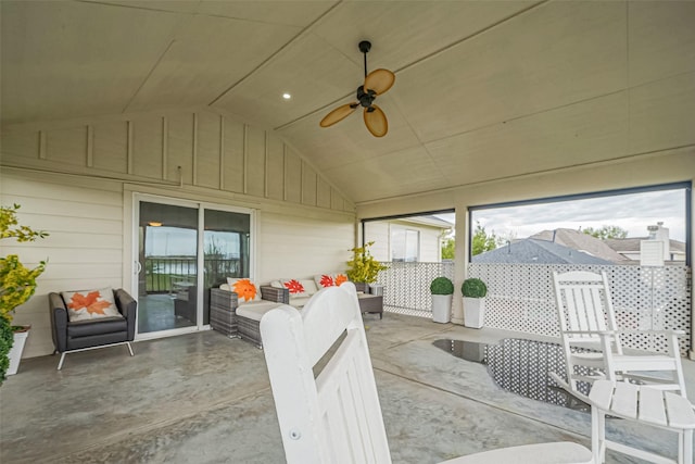 sunroom featuring ceiling fan