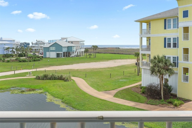 4131 Pointe W Dr Unit 203, Galveston, TX 77554 - surrounding community featuring a yard, a water view, and a residential view