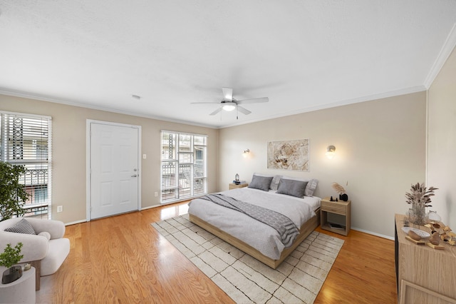 3502 Burlington St Unit 5, Houston, TX 77006 - bedroom with multiple windows, light wood-style flooring, and crown molding