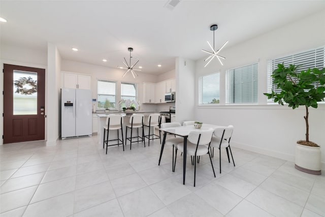 15115 Parkland Canyon Dr, Cypress, TX 77433 - dining area with recessed lighting, a chandelier, light tile patterned floors, and baseboards