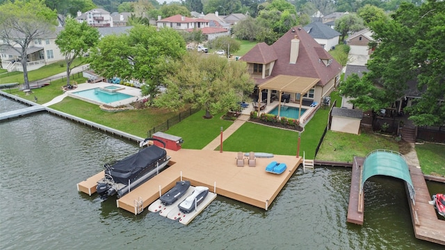 birds eye view of property featuring a residential view and a water view