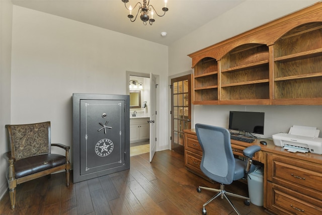 office space with a chandelier, baseboards, and dark wood-style floors