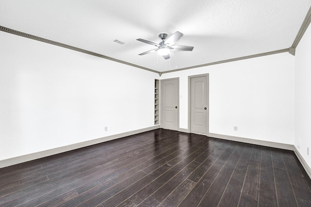 spare room featuring ceiling fan, visible vents, crown molding, baseboards, and dark wood-type flooring