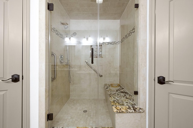 bathroom featuring a shower stall