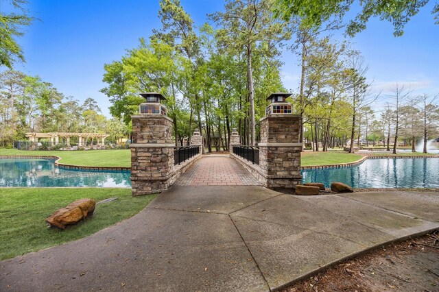 12126 Guadalupe Trail Ln, Humble, TX 77346 - view of community with a water view and a yard