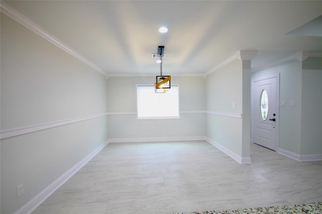 empty room featuring ornamental molding, baseboards, and recessed lighting