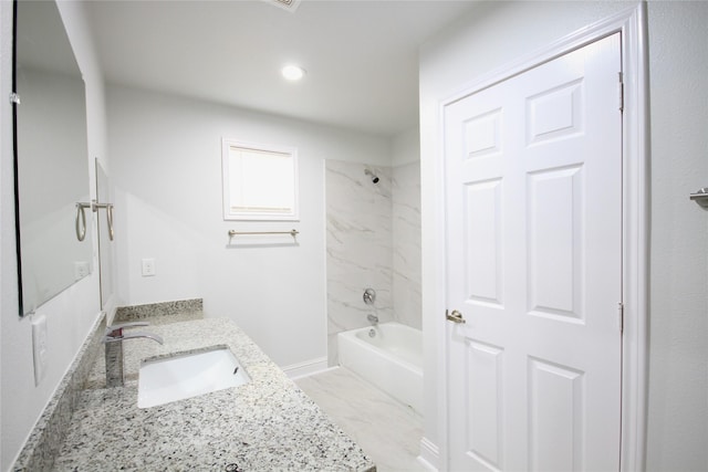 bathroom featuring vanity and tub / shower combination