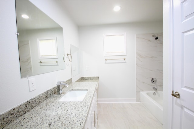 full bath with vanity, recessed lighting, tub / shower combination, and baseboards