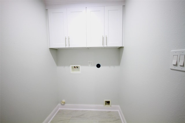 laundry room with cabinet space, baseboards, washer hookup, hookup for an electric dryer, and carpet flooring