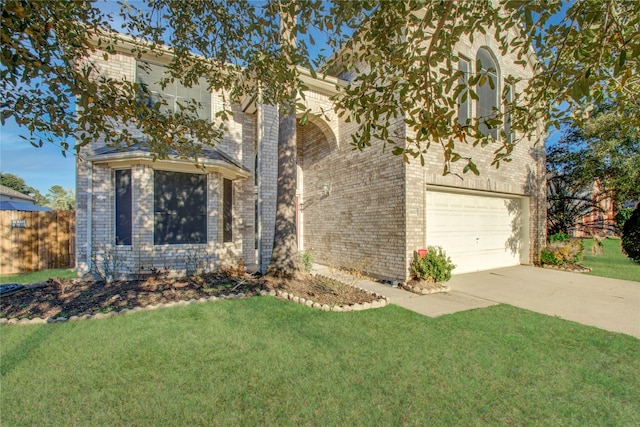 21122 Covington Bridge Dr, Spring, TX 77388 - view of front of house with driveway, an attached garage, and brick siding