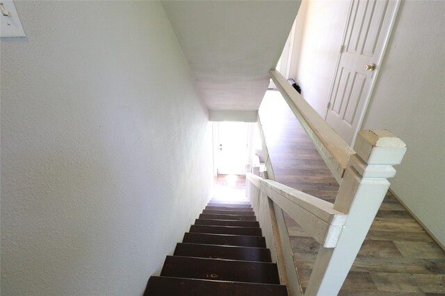 stairs with wood finished floors