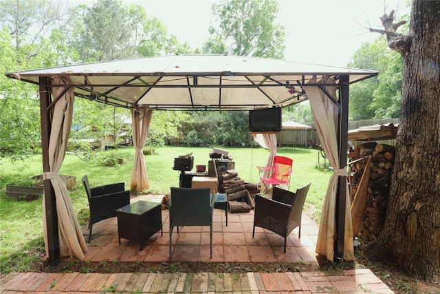 view of patio / terrace featuring an outdoor hangout area, a gazebo, and fence