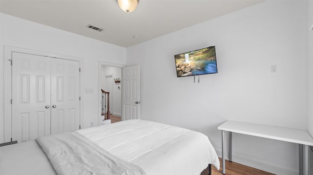 bedroom featuring a closet and visible vents