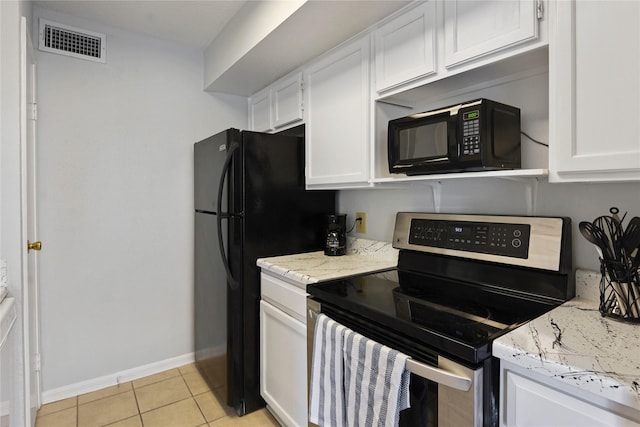 2120 El Paseo St Unit 1503, Houston, TX 77054 - kitchen featuring light tile patterned flooring, visible vents, baseboards, white cabinetry, and black appliances