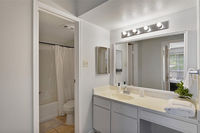 2120 El Paseo St Unit 1503, Houston, TX 77054 - full bathroom with toilet, tile patterned flooring, vanity, and a textured ceiling