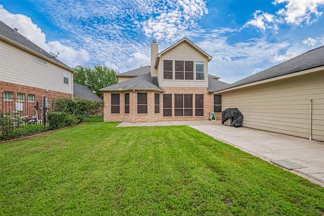 1218 Ventura Canyon Dr, Katy, TX 77494 - back of house featuring a patio, a chimney, brick siding, a yard, and fence