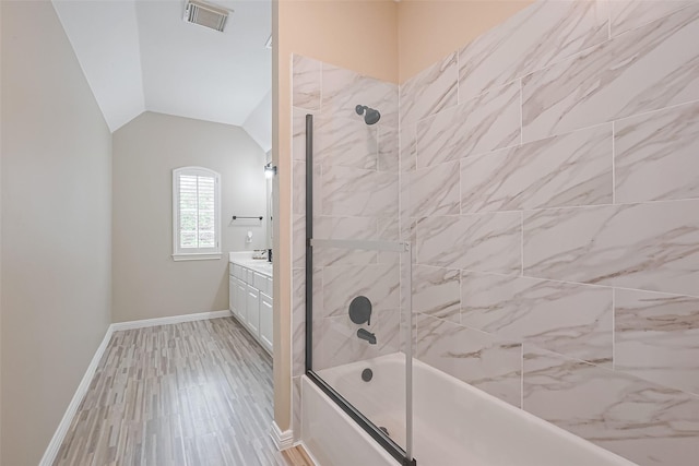 1218 Ventura Canyon Dr, Katy, TX 77494 - full bath with vanity, visible vents, combined bath / shower with glass door, lofted ceiling, and baseboards