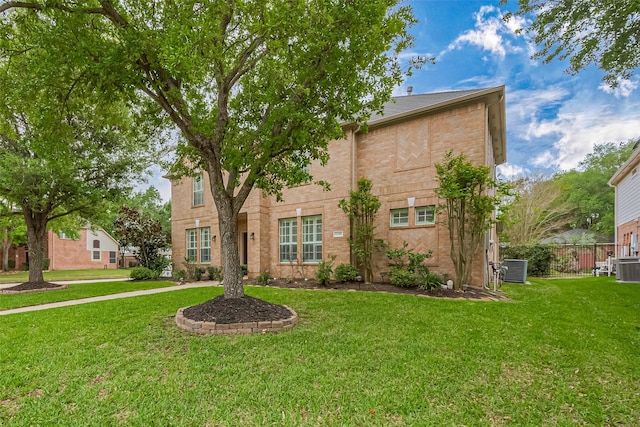 1218 Ventura Canyon Dr, Katy, TX 77494 - traditional-style home featuring a front yard, fence, and central AC