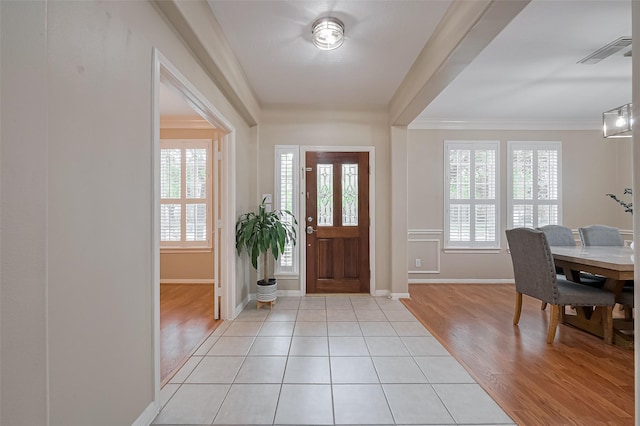 1218 Ventura Canyon Dr, Katy, TX 77494 - foyer entrance featuring light wood finished floors, visible vents, baseboards, and crown molding