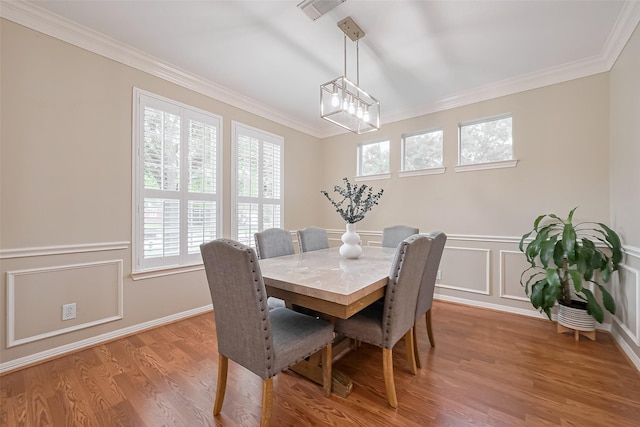1218 Ventura Canyon Dr, Katy, TX 77494 - dining room featuring a decorative wall, light wood finished floors, visible vents, and crown molding