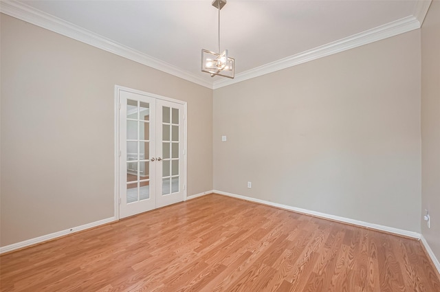 1218 Ventura Canyon Dr, Katy, TX 77494 - spare room featuring crown molding, french doors, light wood-style flooring, and an inviting chandelier