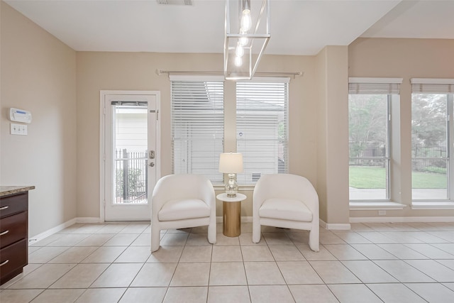 1218 Ventura Canyon Dr, Katy, TX 77494 - living area featuring visible vents, baseboards, and light tile patterned flooring