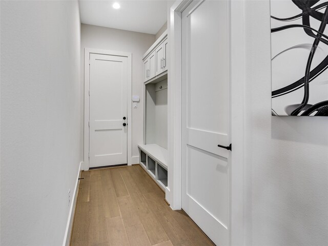 10114 Mariner Oaks Dr, Missouri City, TX 77459 - mudroom with baseboards and light wood-type flooring