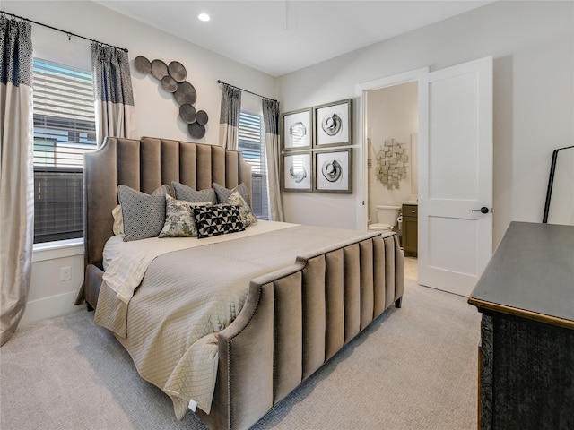 10114 Mariner Oaks Dr, Missouri City, TX 77459 - bedroom with light carpet, baseboards, ensuite bathroom, and recessed lighting