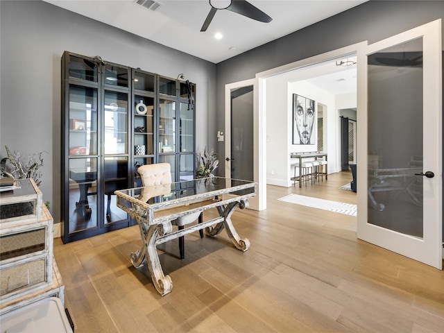 10114 Mariner Oaks Dr, Missouri City, TX 77459 - home office with french doors, light wood finished floors, baseboards, visible vents, and ceiling fan