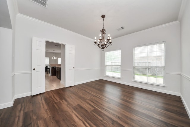 313 Overlook Dr, Friendswood, TX 77546 - unfurnished room featuring dark wood finished floors, baseboards, ornamental molding, and an inviting chandelier