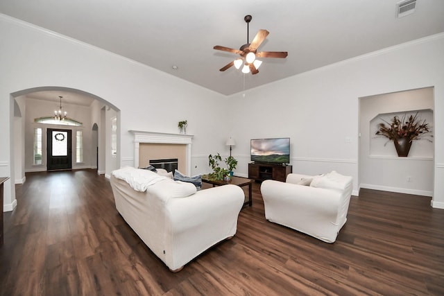313 Overlook Dr, Friendswood, TX 77546 - living area with crown molding, arched walkways, dark wood-style floors, visible vents, and a ceiling fan