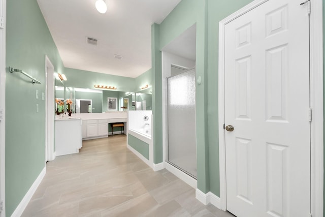 313 Overlook Dr, Friendswood, TX 77546 - full bath featuring vanity, a stall shower, baseboards, and visible vents