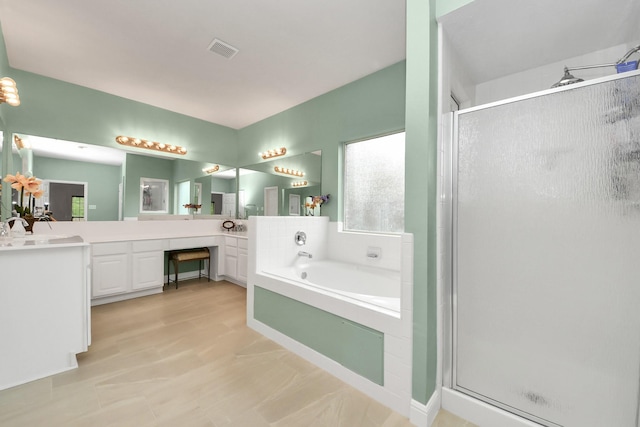 313 Overlook Dr, Friendswood, TX 77546 - bathroom with a stall shower, visible vents, vanity, and a bath