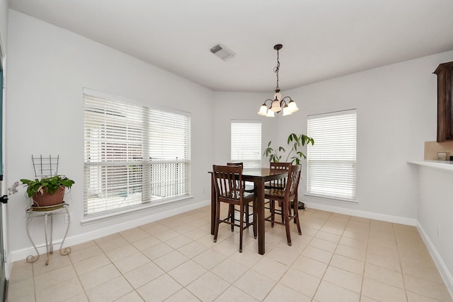 313 Overlook Dr, Friendswood, TX 77546 - dining room with baseboards, visible vents, a chandelier, and light tile patterned floors