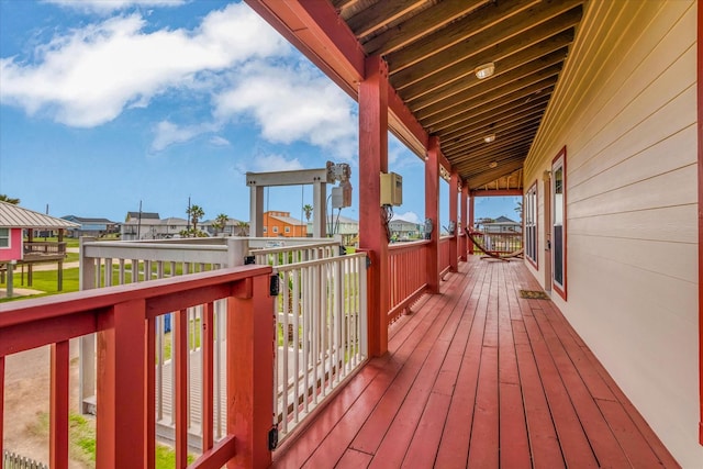 702 Surf Dr, Surfside Beach, TX 77541 - wooden terrace featuring a residential view
