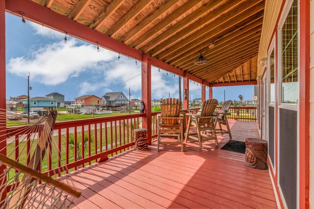 702 Surf Dr, Surfside Beach, TX 77541 - wooden deck with a residential view