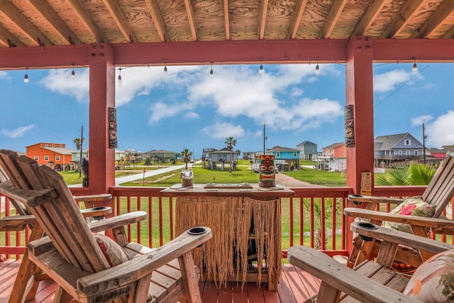 702 Surf Dr, Surfside Beach, TX 77541 - deck featuring a lawn and a residential view