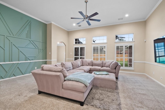 carpeted living area with recessed lighting, ceiling fan, visible vents, baseboards, and ornamental molding