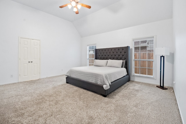 bedroom featuring baseboards, a ceiling fan, lofted ceiling, and carpet flooring