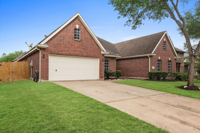 view of front facade featuring concrete driveway, a shingled roof, a front yard, fence, and brick siding