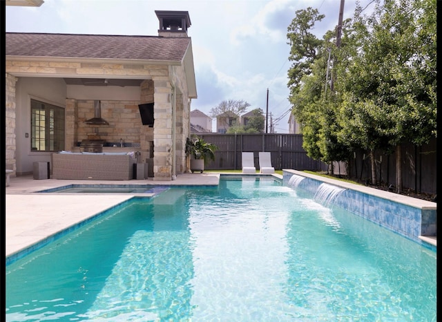 7526 Janak Dr, Houston, TX 77055 - view of swimming pool with exterior kitchen, a fenced backyard, a patio, and a sink