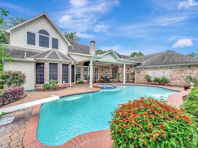 view of swimming pool with a patio area, fence, ceiling fan, and a fenced in pool
