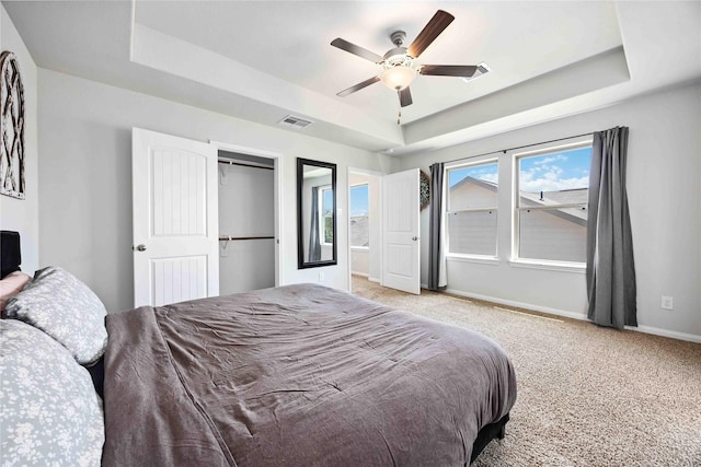 212 Bryan Way, Angleton, TX 77515 - bedroom featuring baseboards, a ceiling fan, visible vents, a raised ceiling, and light colored carpet